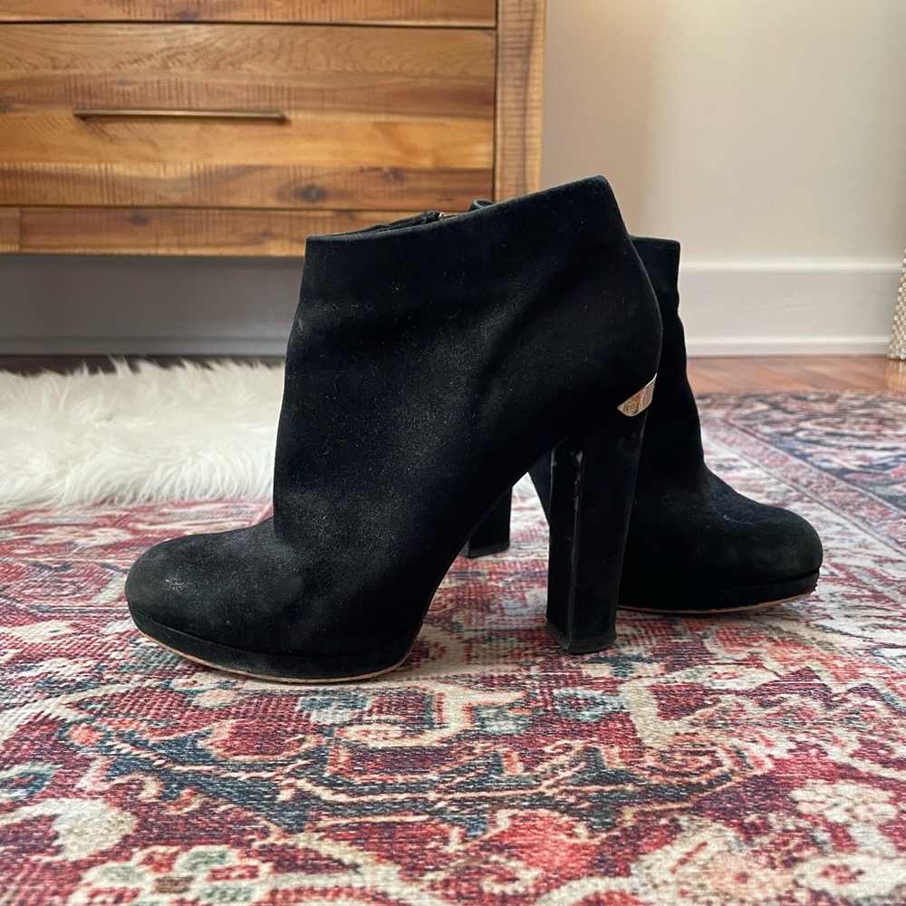 Michael Kors black suede ankle boot with gold details. Size 7. 3.5 inch heel.